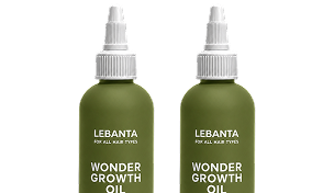Two identical olive green bottles of Lebanta Wonder Growth Oil against a white background.