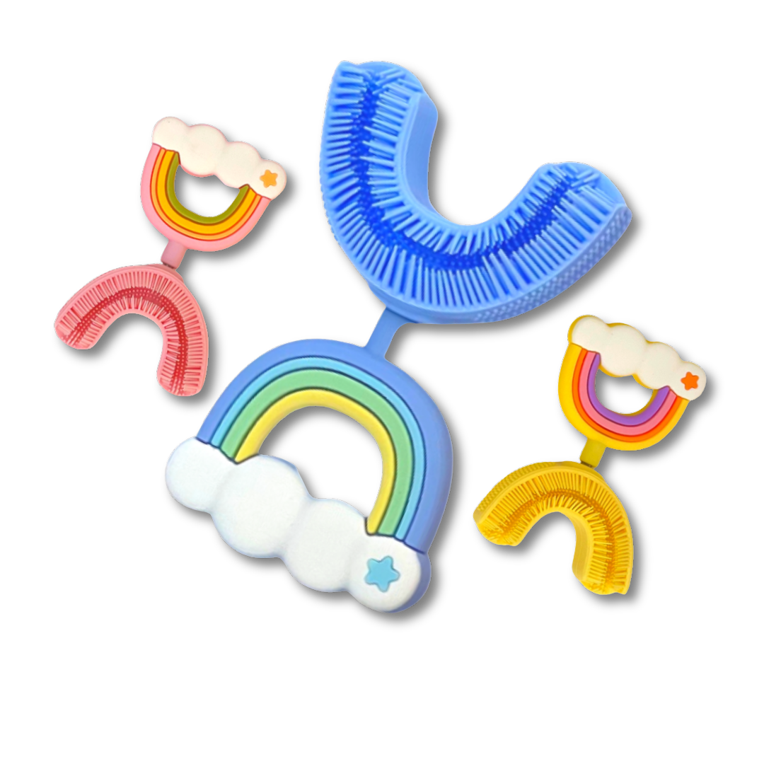 Three colorful, rainbow-themed, U-shaped children's toothbrushes against a solid green background.