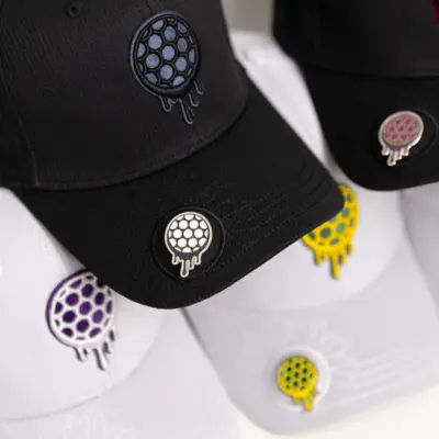 Black and white caps with colorful dripping circle designs.