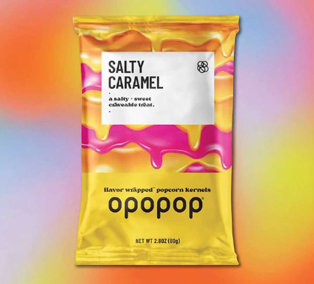 Colorful packaging of Opopop Salty Caramel popcorn against a gradient background.