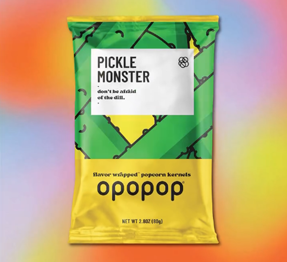 Bag of 'Pickle Monster' flavored popcorn on a colorful background.