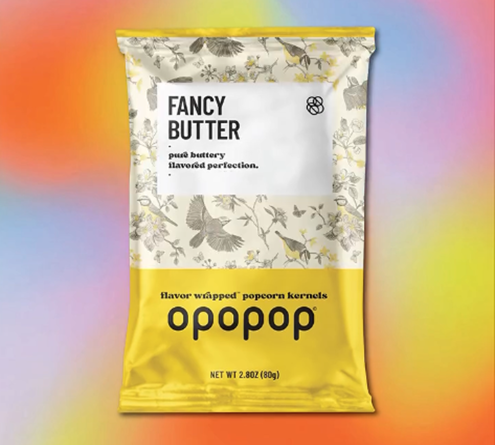 Bag of Opopop Fancy Butter popcorn on a colorful background.