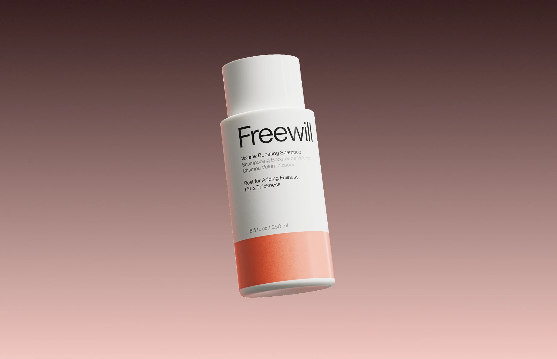 A bottle of Freewill Volume Boosting Shampoo against a gradient background.