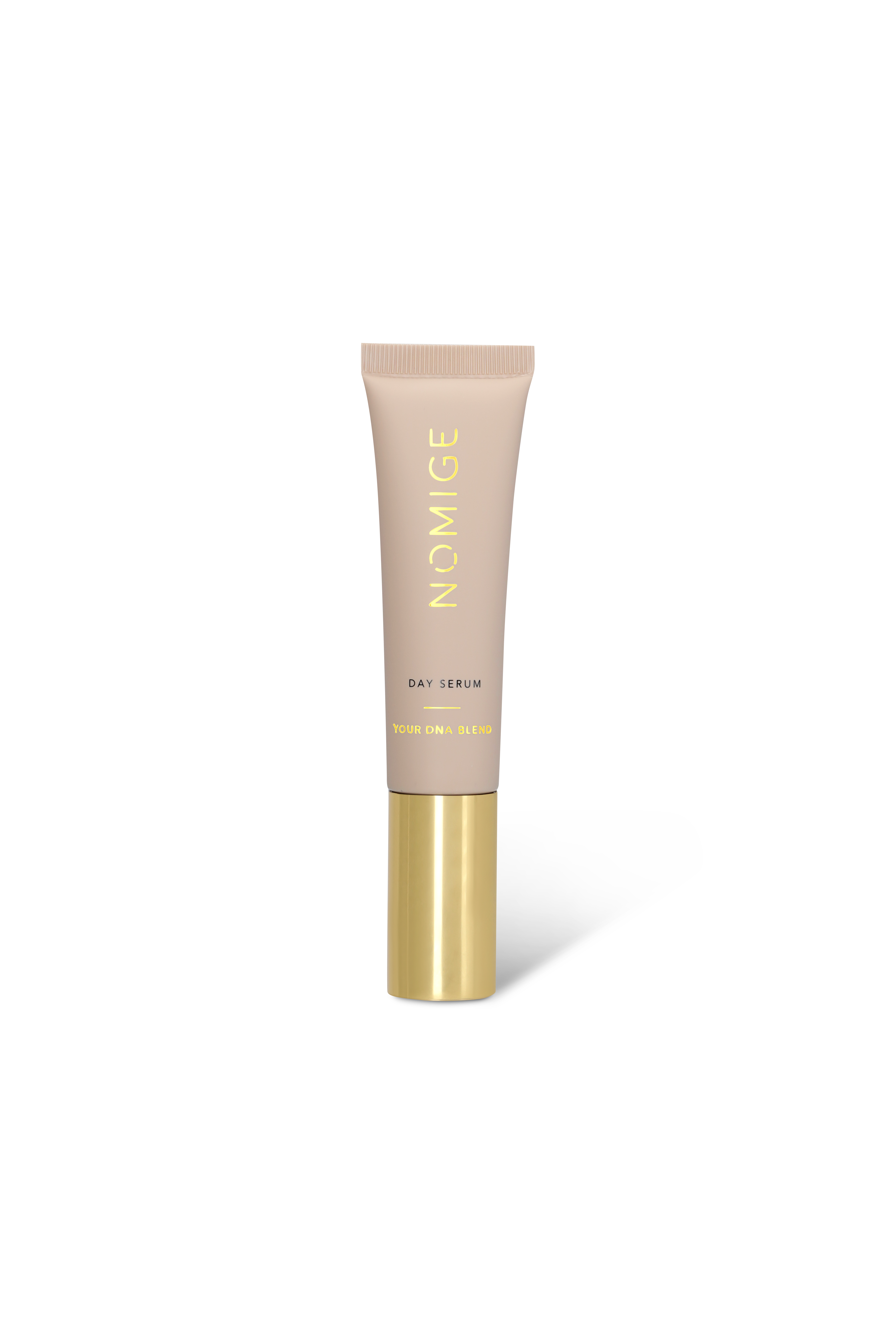 A beige tube of Nomige Day Serum with a gold base against a white background.