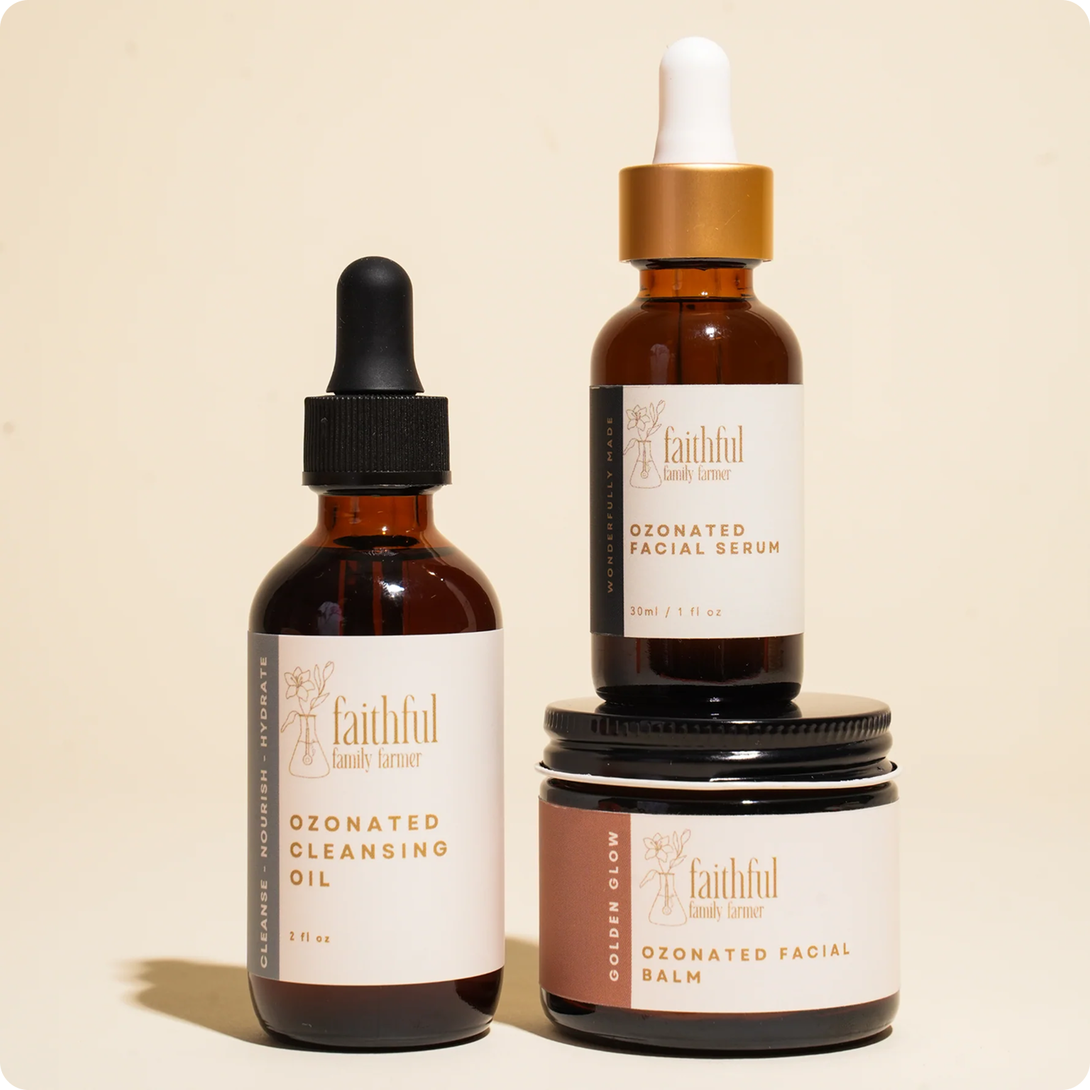 Three Faithful Family Farmer skincare products—cleansing oil, facial balm, and facial serum—arranged against a cream background.