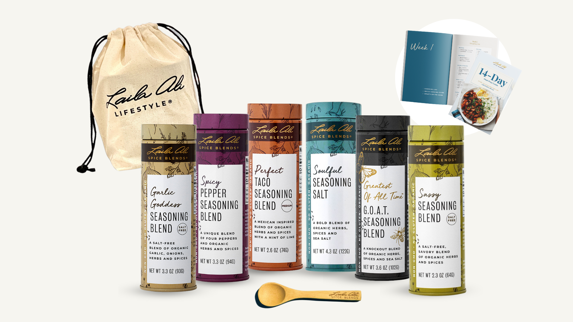 Assorted spice blends, a drawstring bag, a wooden spoon, and recipe booklets.