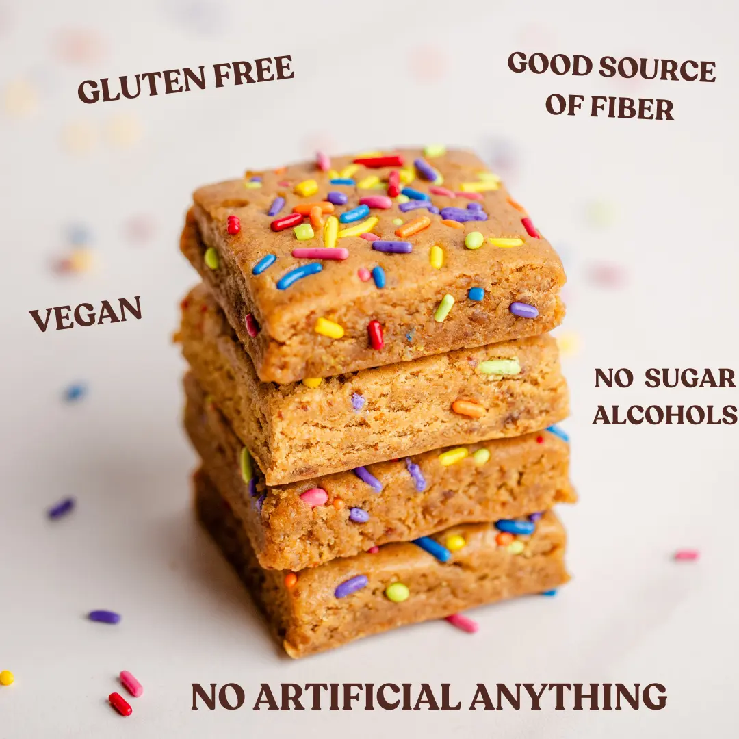 Stack of sprinkle-topped bars with gluten-free, vegan, and other labels.