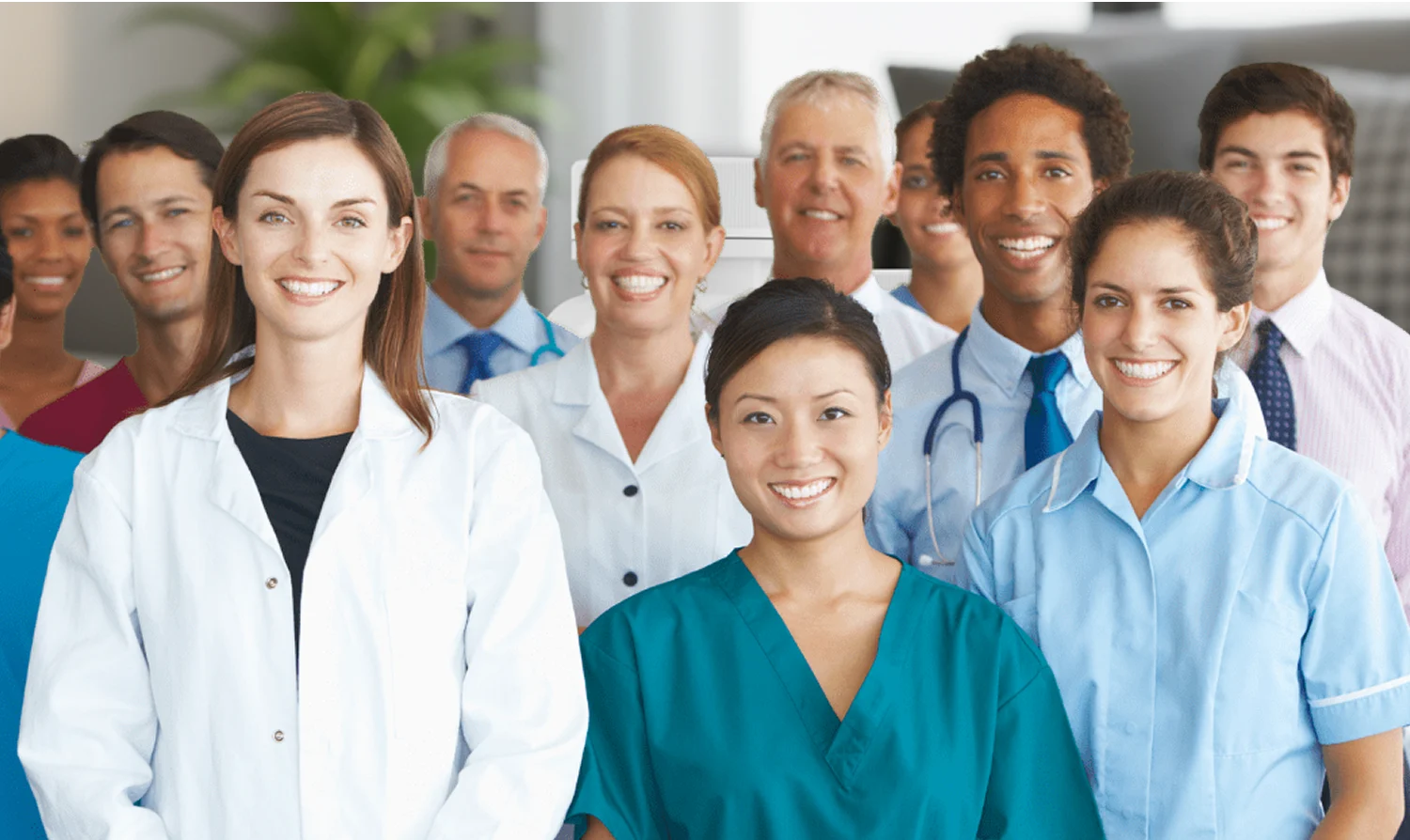 Group of healthcare professionals smiling at the camera.