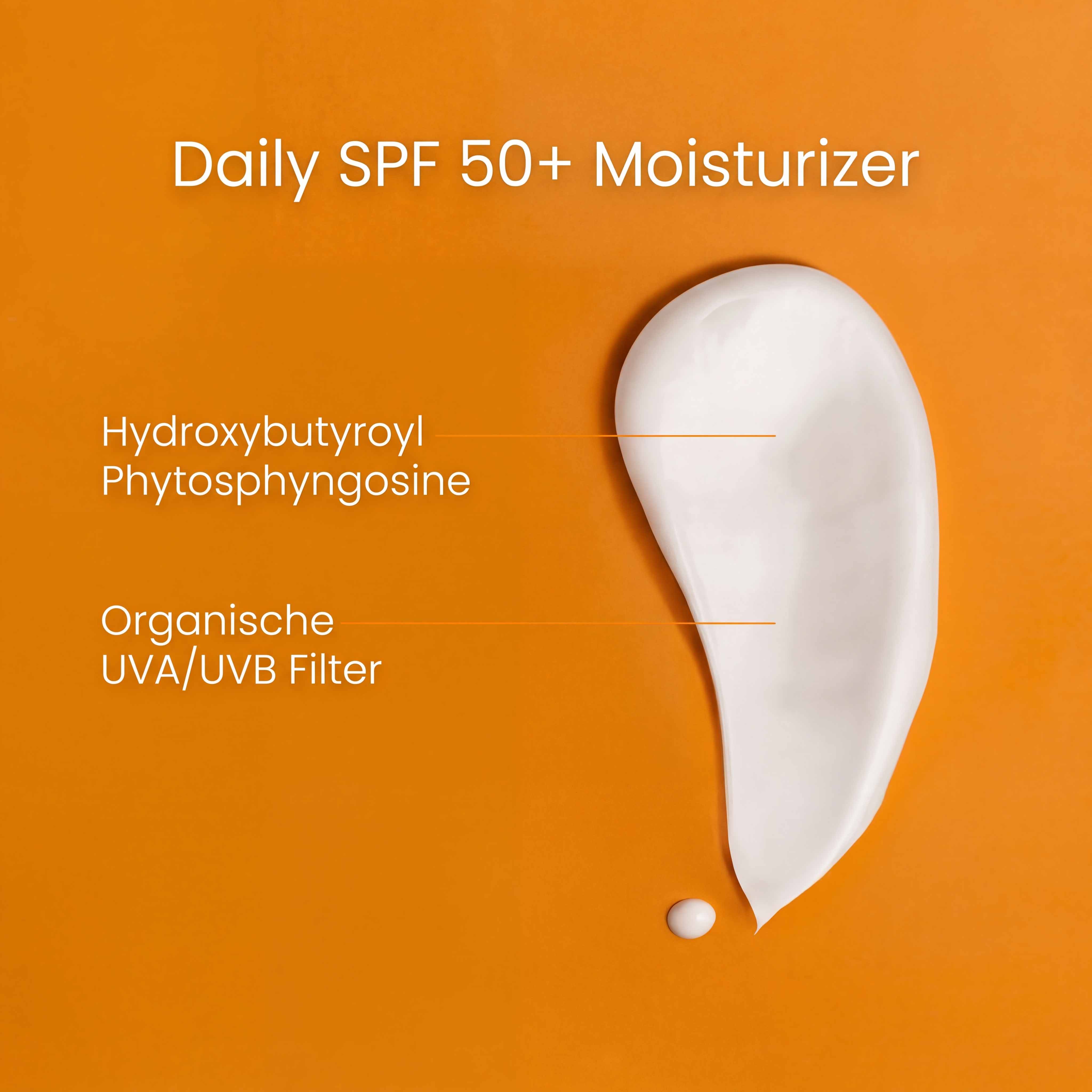 A smear of white moisturizer on an orange background with text describing its SPF 50+ and ingredients.