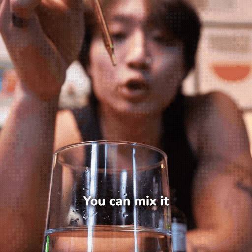 Person holding a stirrer above a glass with text 'You can mix it'.