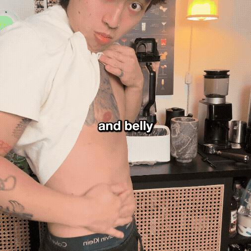 Person lifting shirt to show stomach with text overlay 'and belly'.