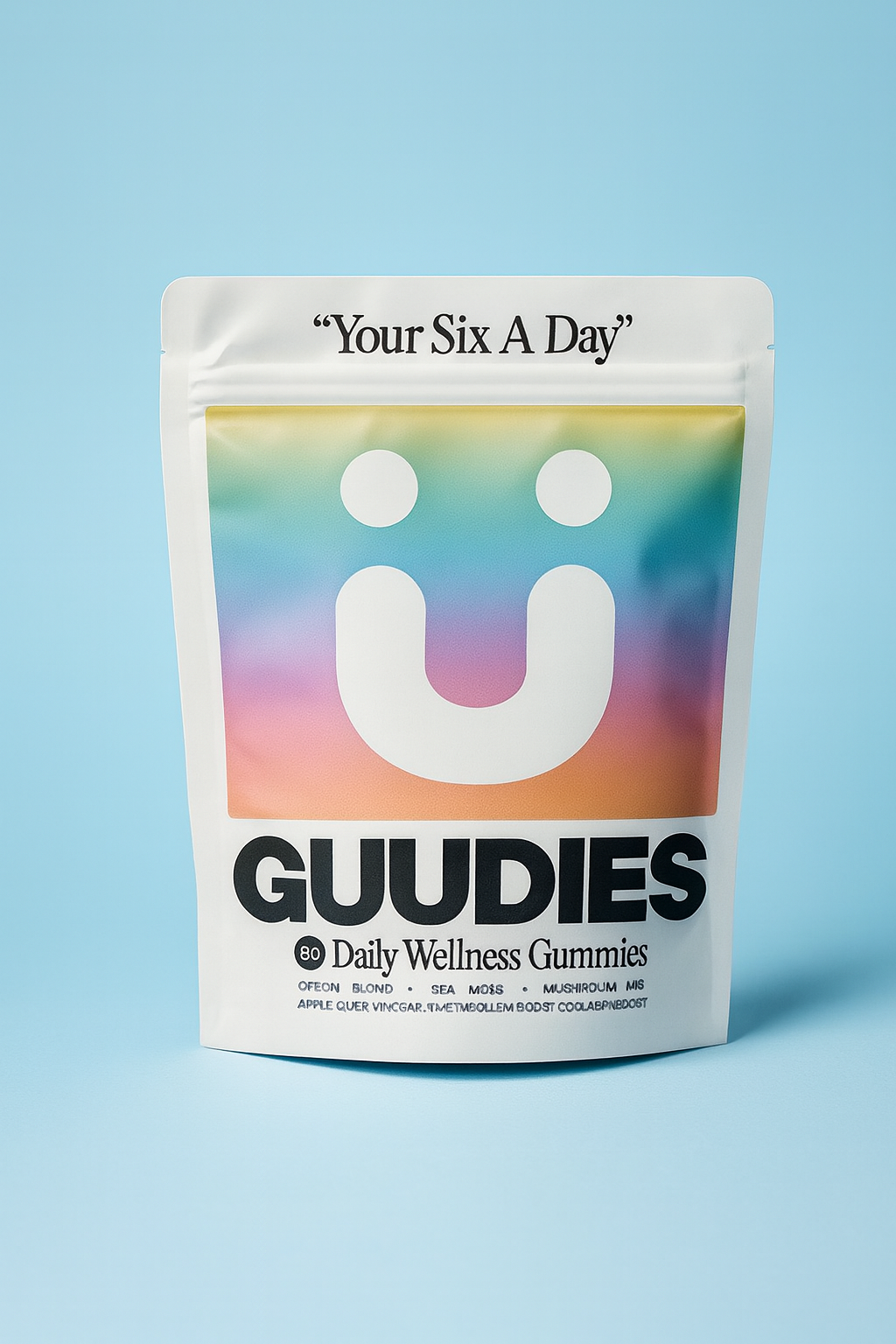 Colorful gummy packaging with the brand name 'GUUDIES' and a smiley face design.