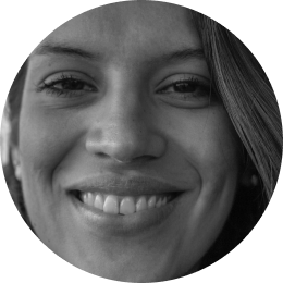 Black and white close-up of a smiling person.