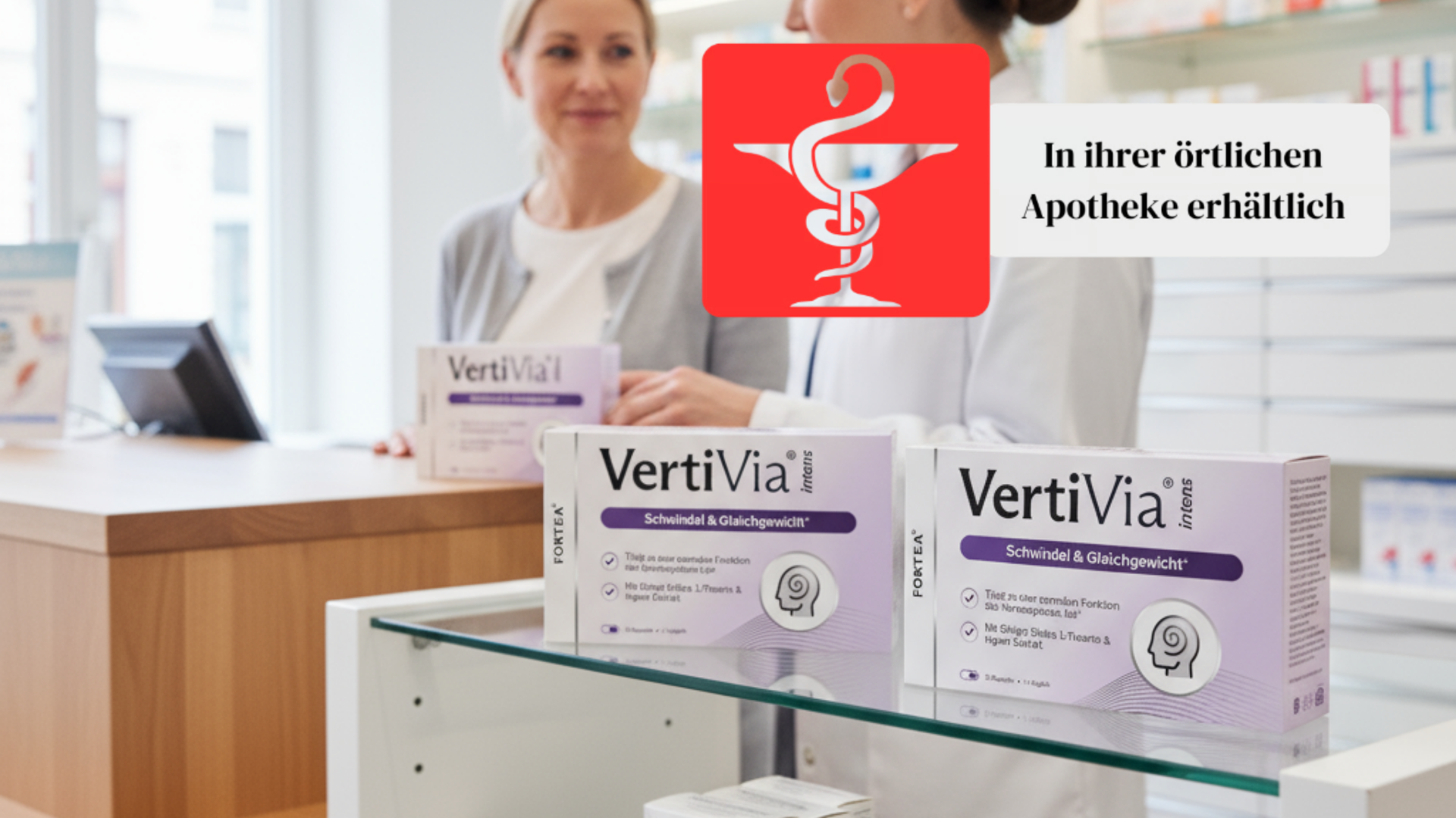 Pharmacy counter with VertiVia boxes and logo, two people in background.