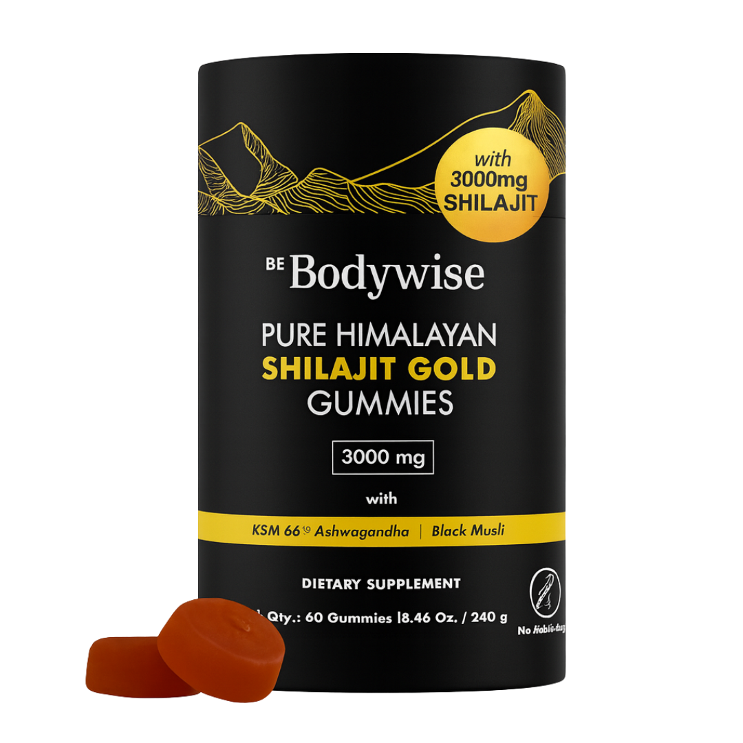 Black container of Shilajit Gold Gummies with orange gummies in front.