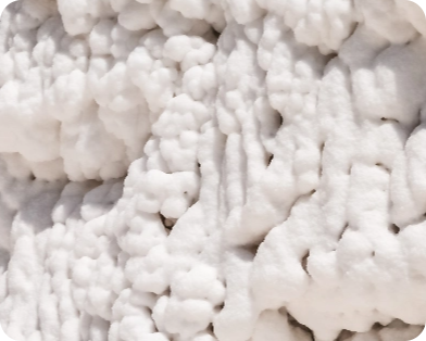 Close-up of a textured white surface resembling salt formations.