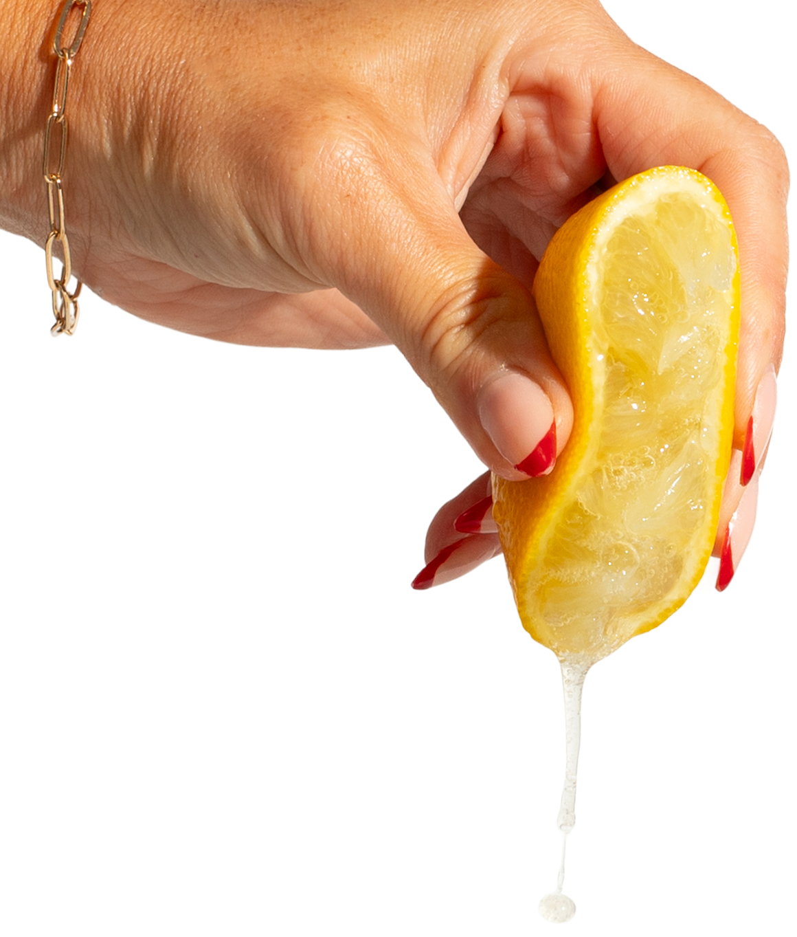 Hand squeezing lemon juice, wearing a bracelet.