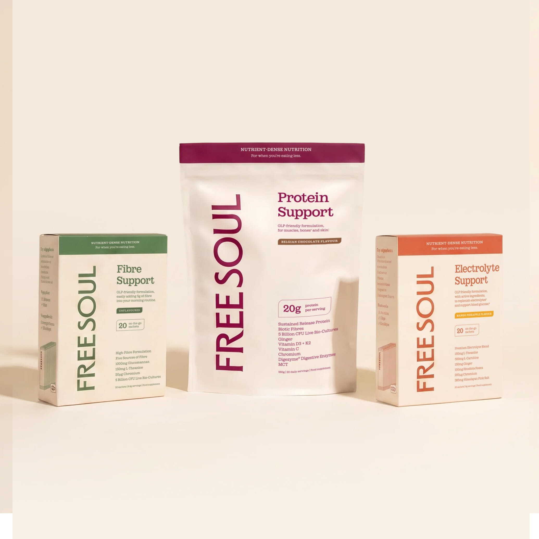 Three Freesoul nutritional supplement products, Protein, Fibre, and Electrolyte Support, arranged on a cream-colored surface.