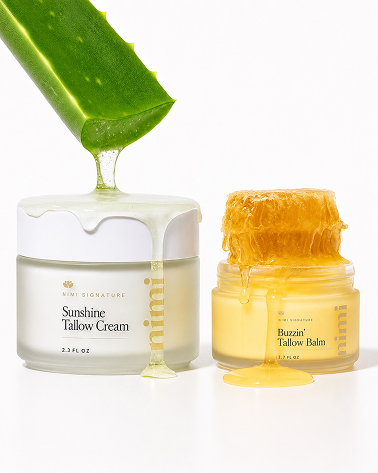 Two jars of skincare with fresh aloe vera and honeycomb dripping onto them against a white background.