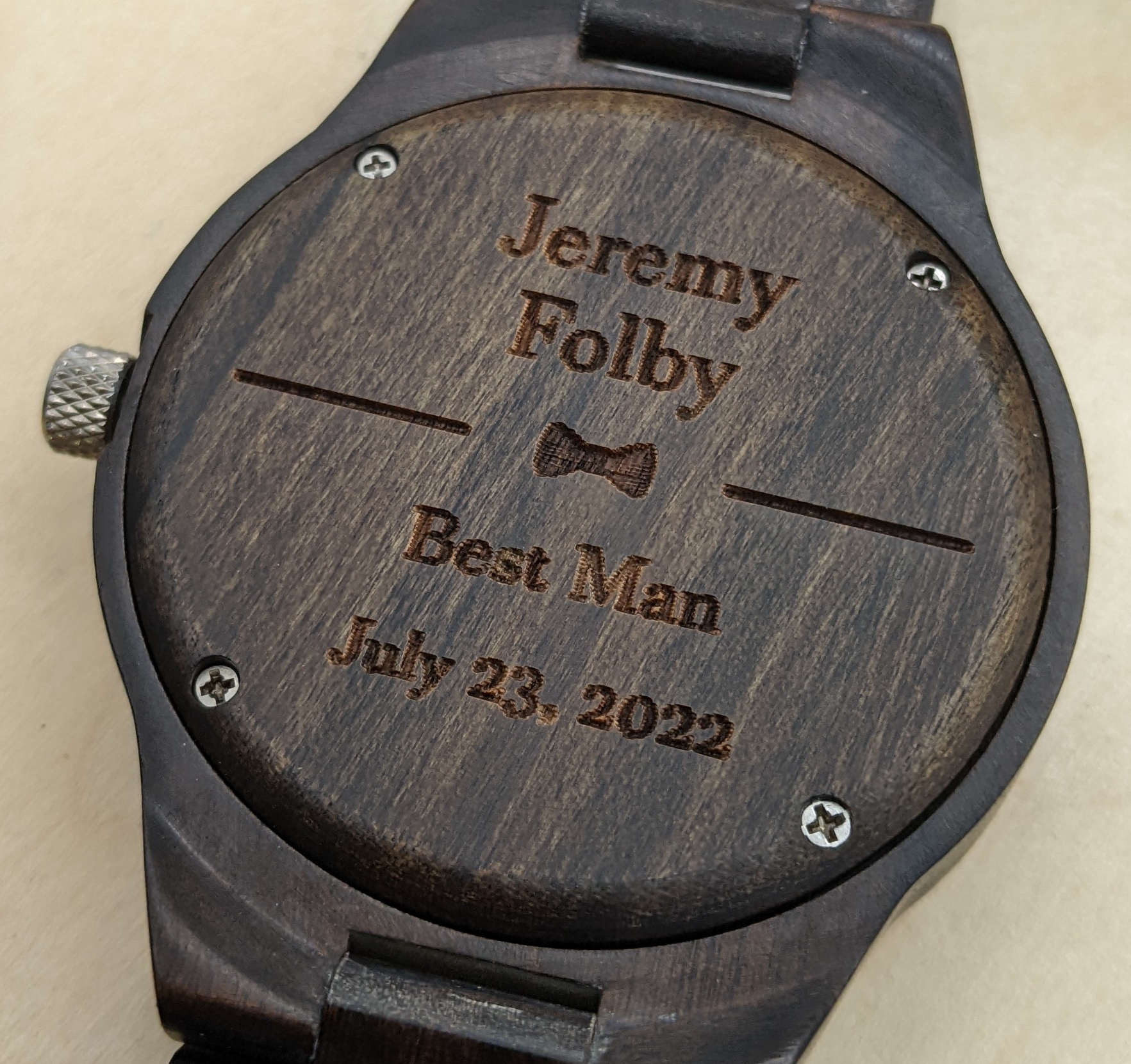 Wooden watch back engraved with 'Jeremy Folby, Best Man, July 23, 2022.'