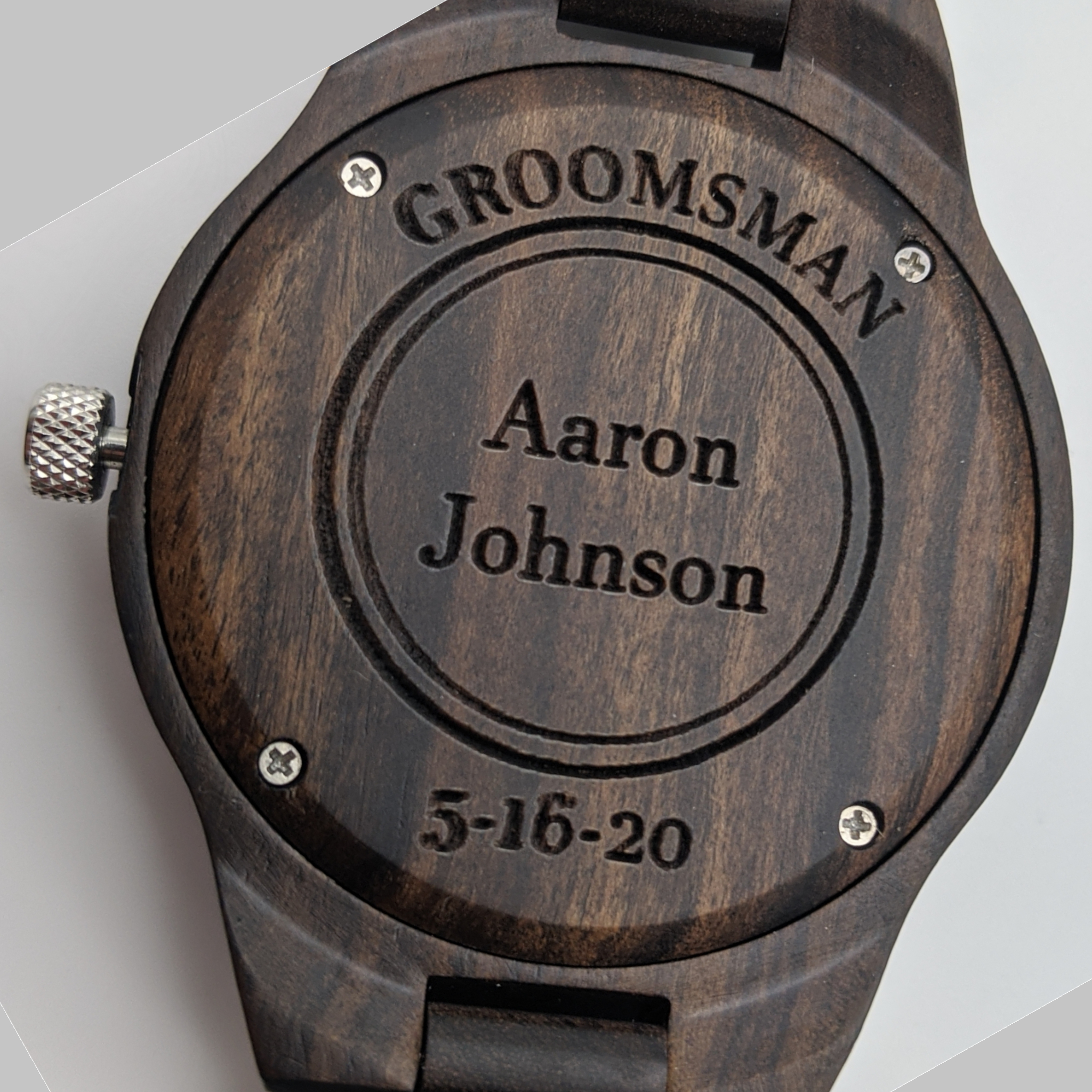 Engraved wooden watch back with 'Groomsman' and a date.