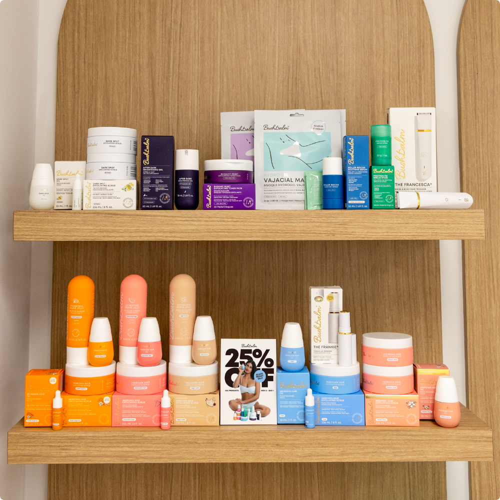 A wide variety of Bushbalm skincare products are displayed on two wooden shelves against a wood background.