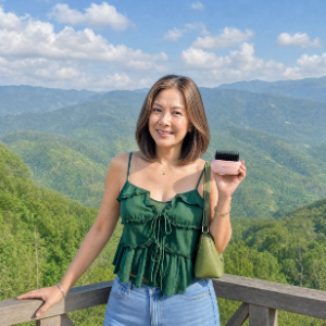 A woman holding a pink hairbrush stands on a balcony overlooking green mountains.