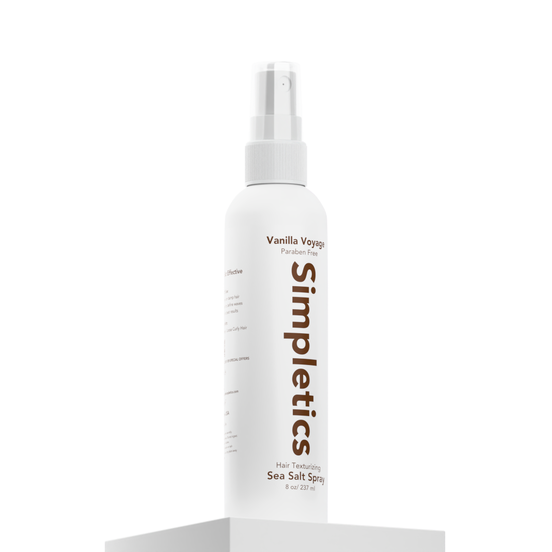 White bottle of Simpletics Sea Salt Spray on a pedestal.