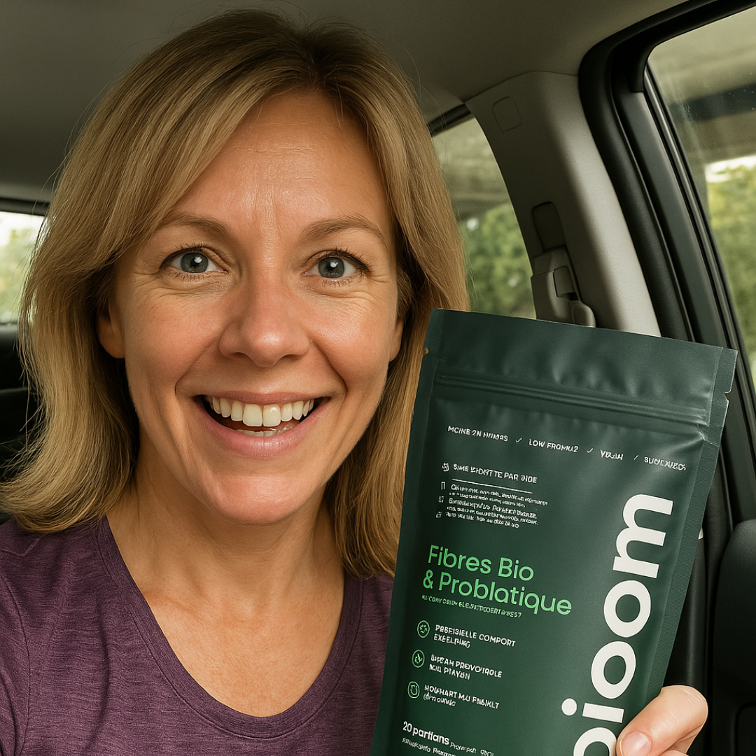 Smiling person in a car holding a green package labeled 'Fibres Bio & Probiotique.'