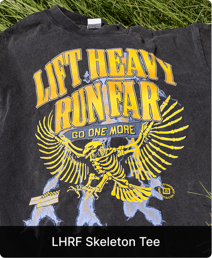 A faded black t-shirt with a yellow graphic of a winged skeleton and text reading 'Lift Heavy Run Far'.