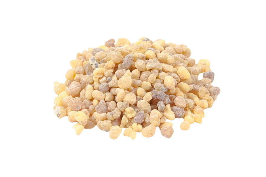 A pile of small, beige and brown resin granules on a white background.