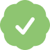 A white checkmark inside a light green, scalloped, badge-like shape.