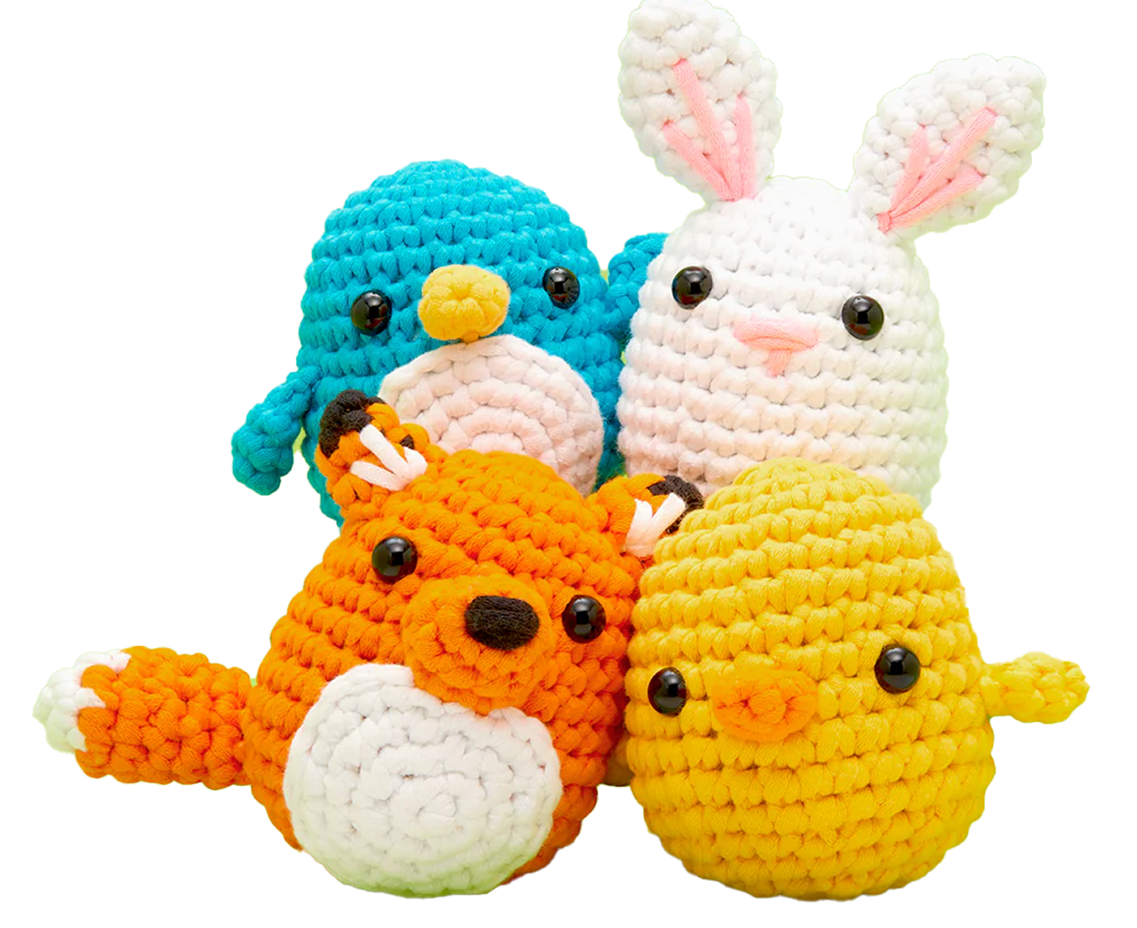 Four crocheted animal plushies: penguin, rabbit, fox, and chick.