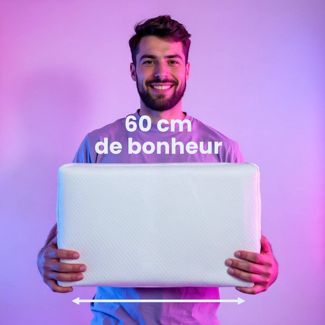 Smiling man holding a white pillow with text '60 cm de bonheur'.