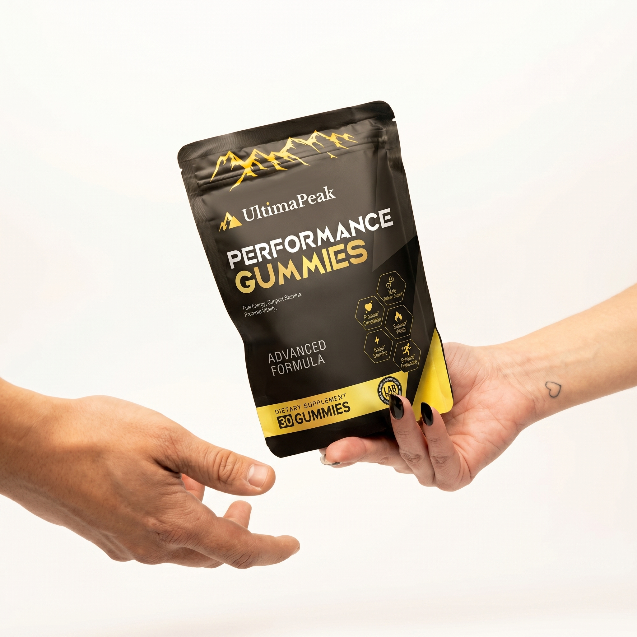 A woman's hand with a heart tattoo passes a pouch of UltimaPeak Performance Gummies to a man's hand.