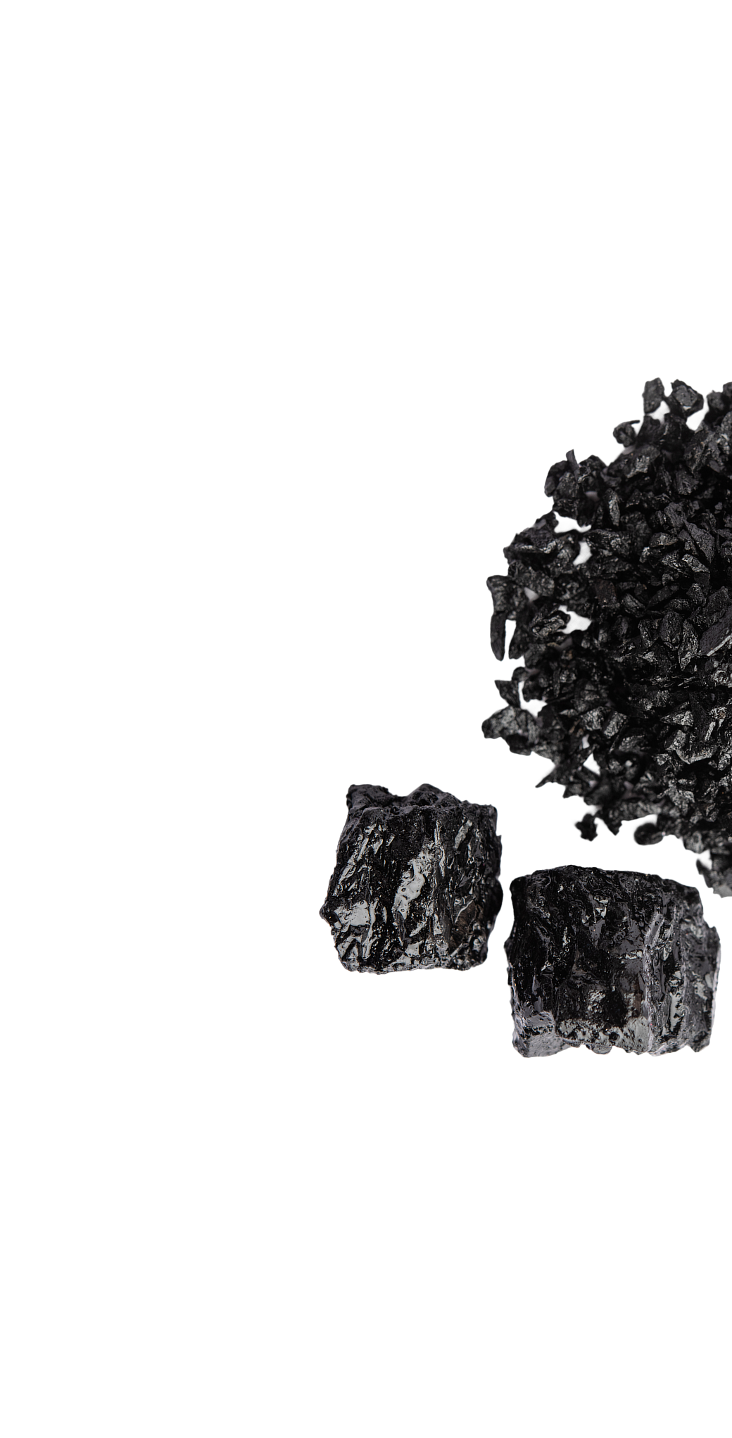 Black coal pieces on a green background.