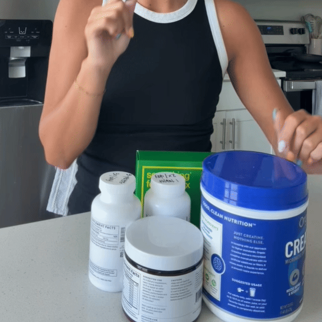 Katie clearing away the old probiotics and fiber supplements from her counter.