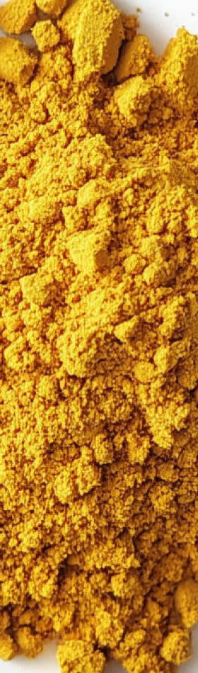 Close-up of yellow powder on a white surface.