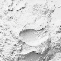Textured white surface with a central indentation.