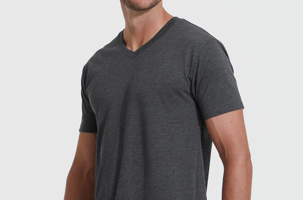 Man wearing a dark gray V-neck T-shirt.