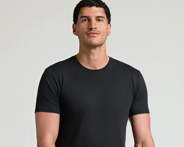 Person wearing a black t-shirt against a plain background.