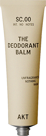 Beige tube labeled 'The Deodorant Balm' with text details and a silver cap.