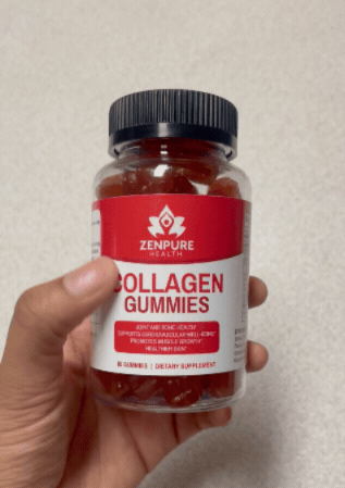 Hand holding a jar of collagen gummies with red label.