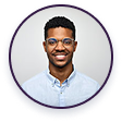 Headshot of a smiling young man wearing glasses and a light blue collared shirt, inside a purple circle.