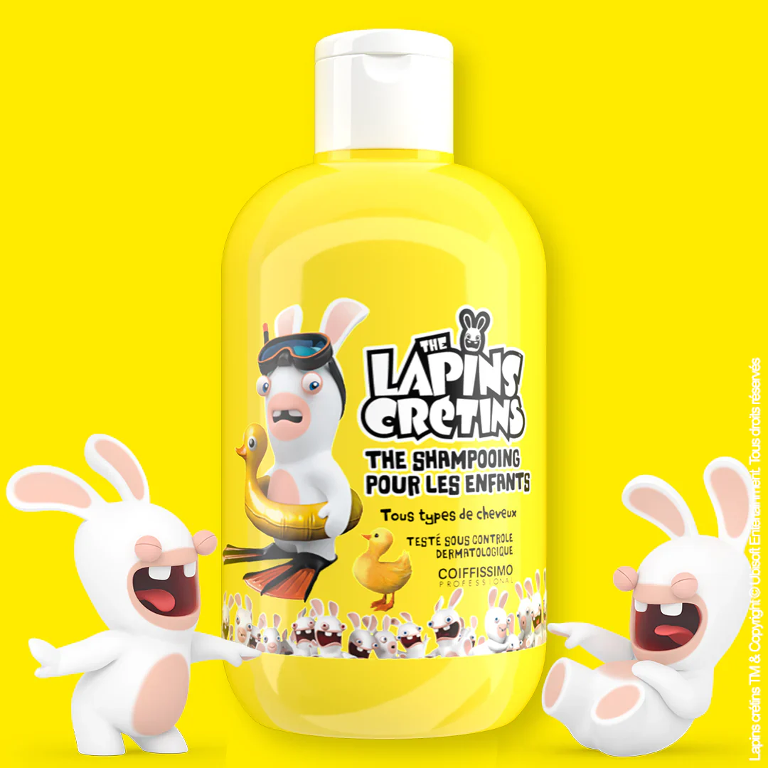 Yellow children's shampoo bottle with cartoon rabbits and a duck float design.