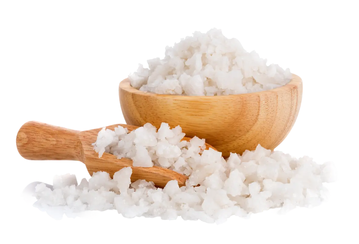 Wooden bowl and scoop filled with coarse salt.