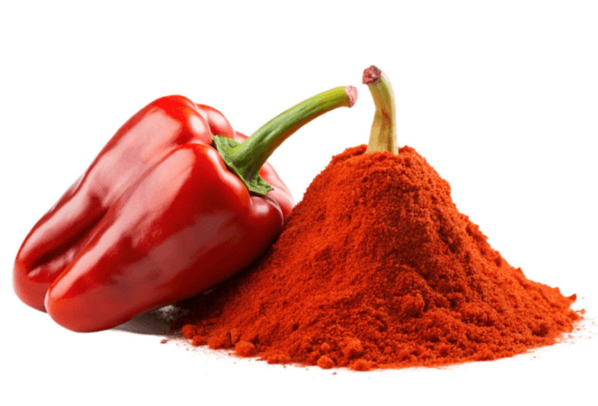 Red bell pepper beside a pile of red powder.