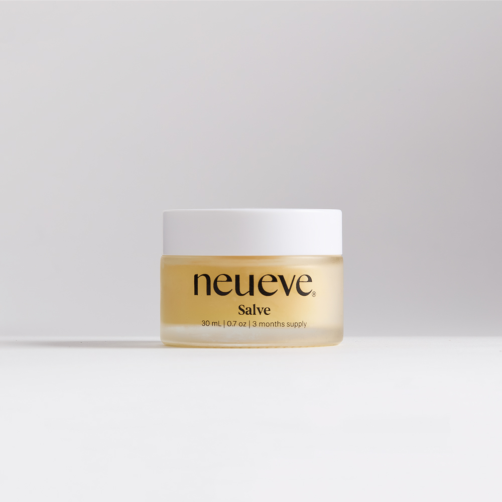 Small jar labeled 'neueve Salve' with white lid on a plain background.
