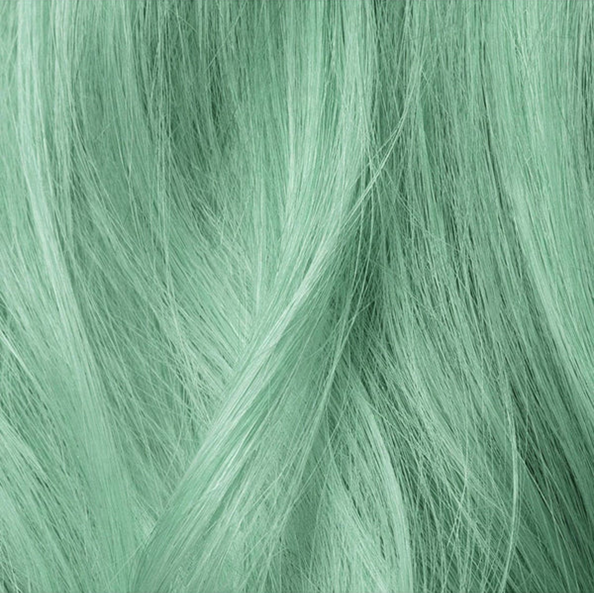 Close-up of mint green hair strands.