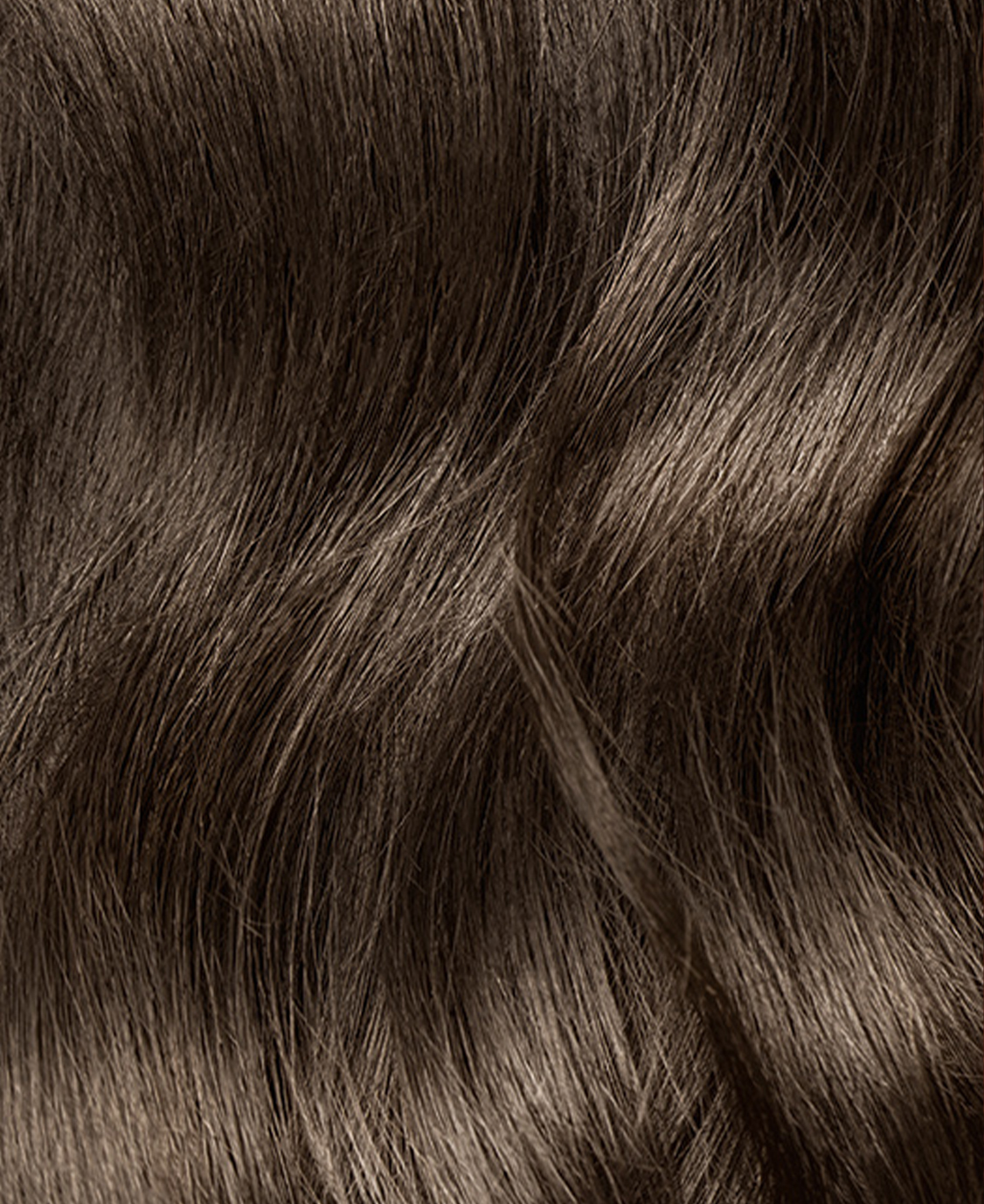 Close-up of wavy brown hair texture.